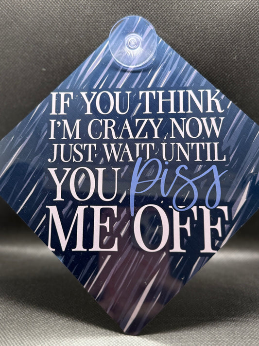 Blue textured square car sign with white text .