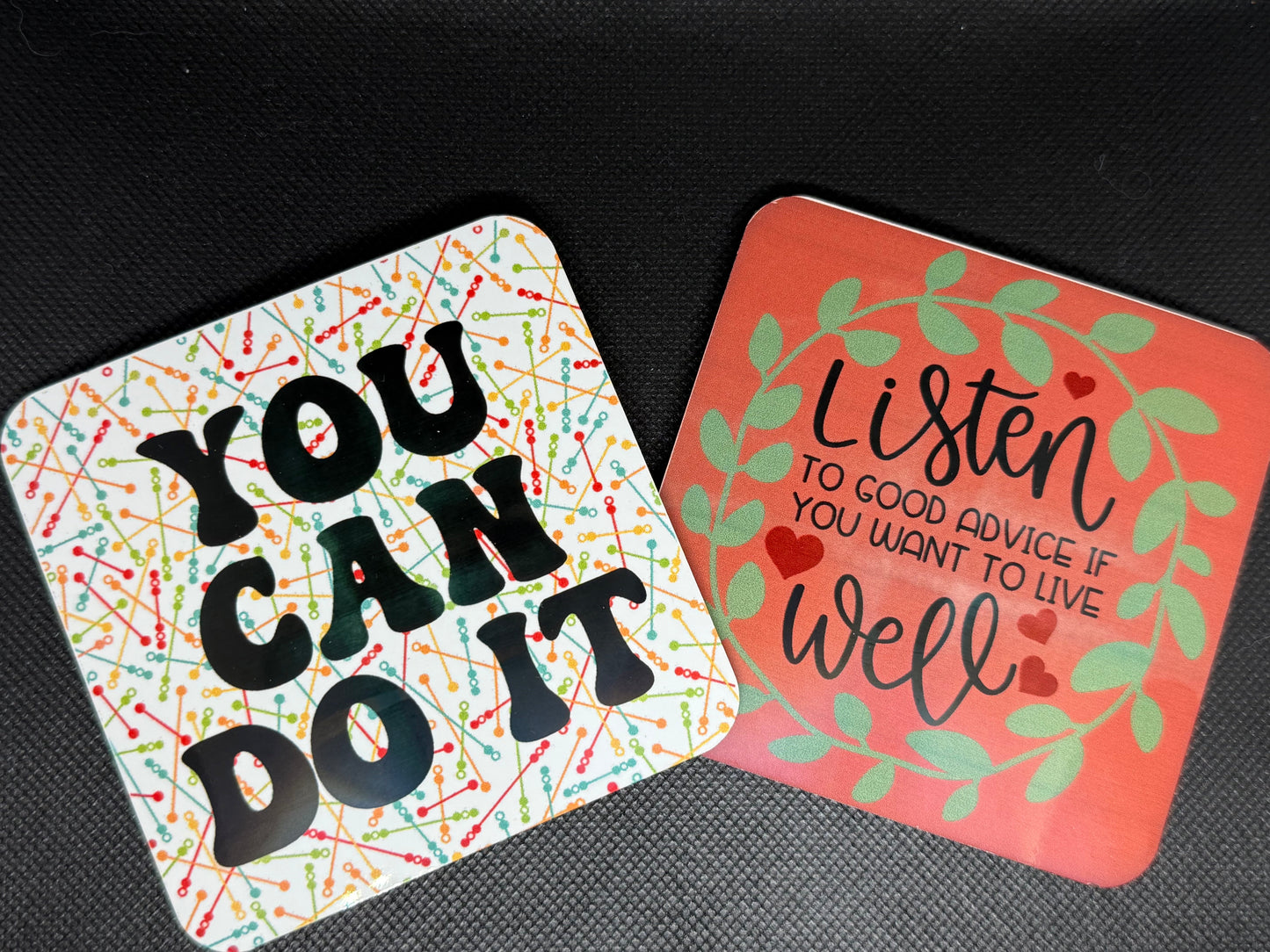 Two motivational coasters with inspirational messages.