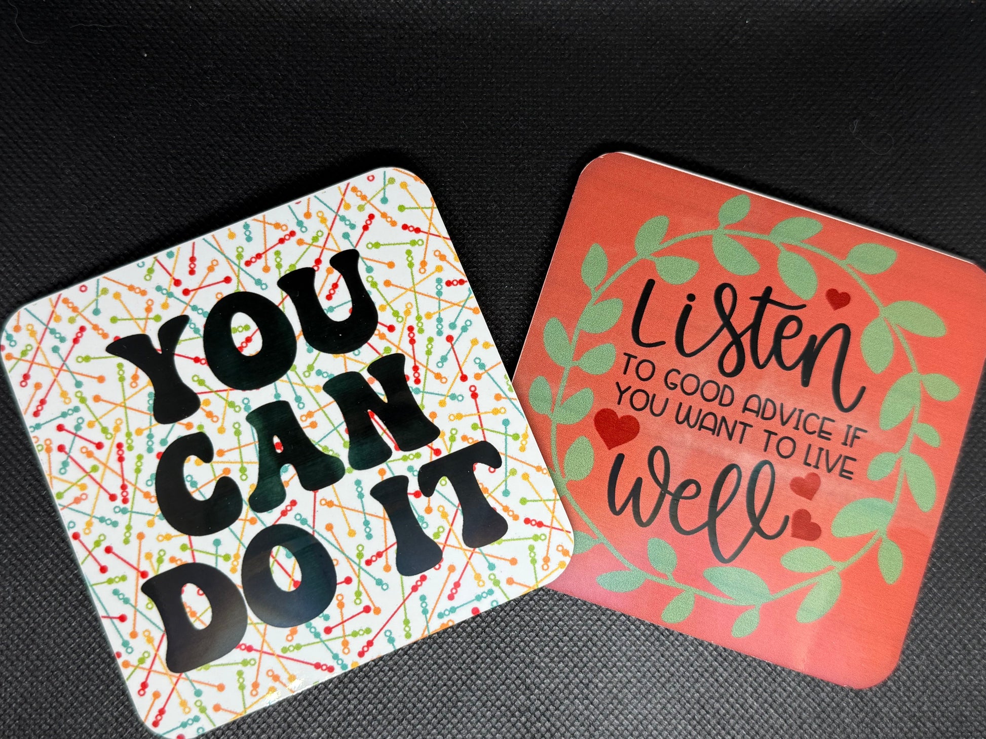 Two motivational coasters with inspirational messages.